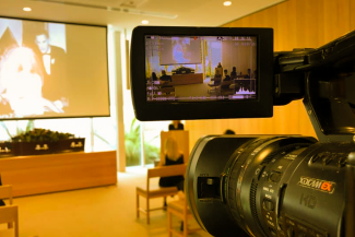 Life Memorials live streaming a photo slide show presentation at a funeral